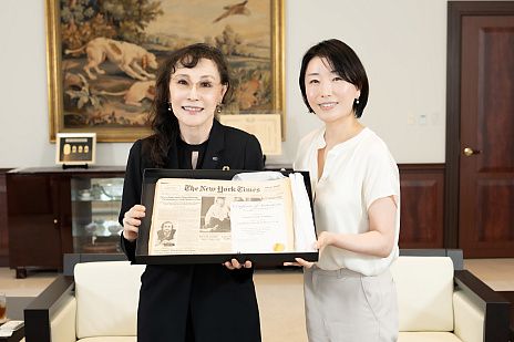 Keiko Erikawa featured in The New York Times, holding a commemorative edition